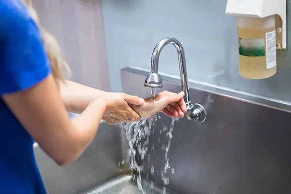 Image of woman washing her hands